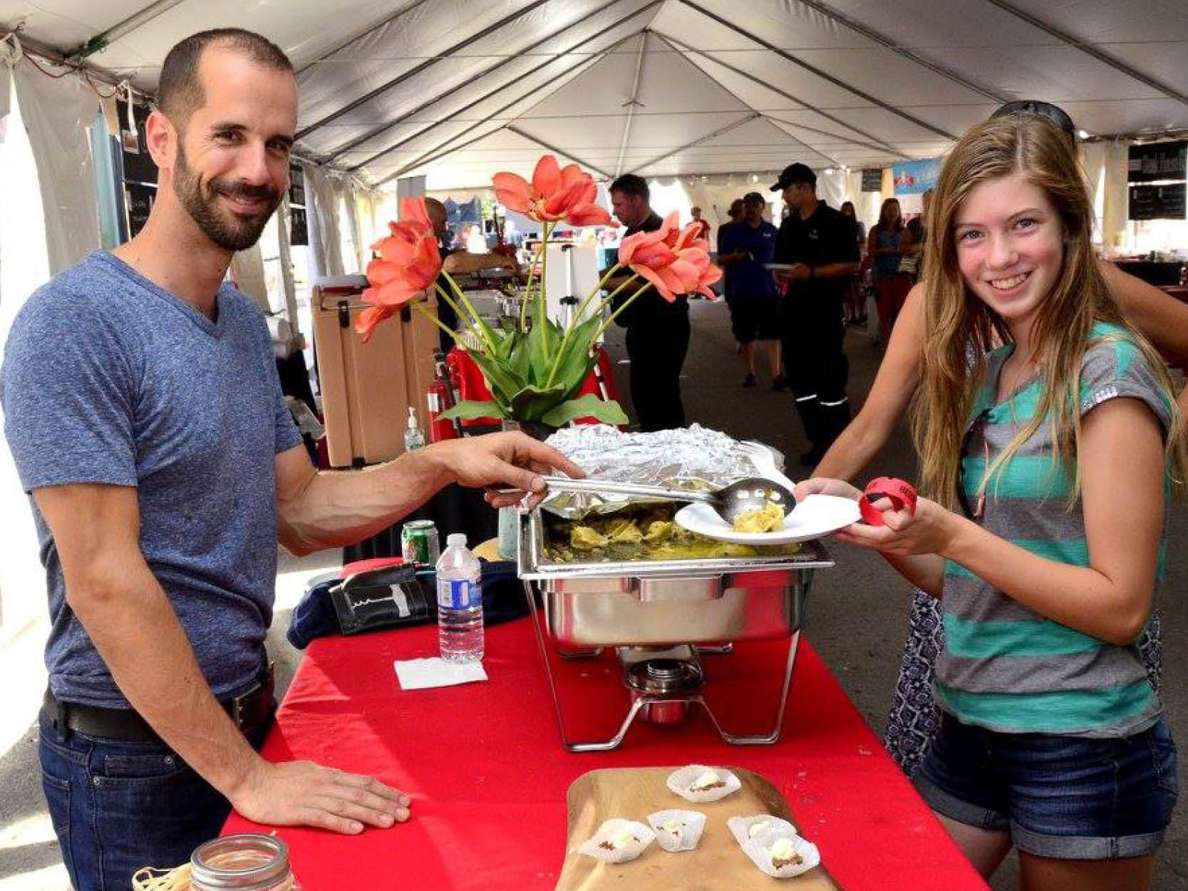 Man serving woman food